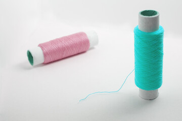 Two spools of thread