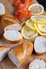 cutting fish fillets during the preparation of a dish of red salmon fish