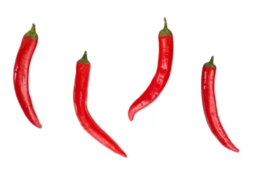 Fotobehang Four hot red peppers on the isolated background © Денис Тетеря