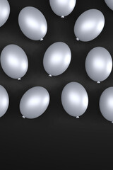 Silver balloons on a black background