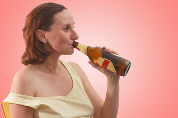 Female alcoholism. Woman drinking beer on the red background