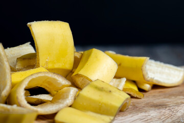the yellow peel that was left after the bananas on the board