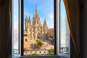 Deurstickers View through an open window from across the plaza of the gothic Barcelona Cathedral in the El Born Gothic Quarter of the Catalonian city of Barcelona, Spain. © Kirk Fisher