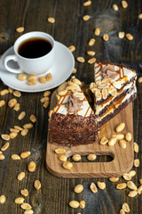caramel cake with peanuts and buttercream, close up