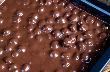 real milk chocolate while cooking with hazelnuts