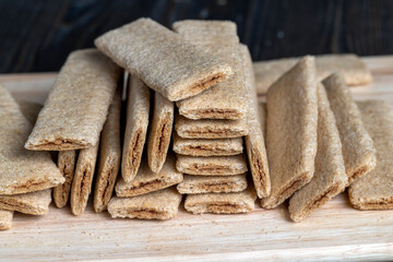 waffle sweets stuffed with grated fruit on the table
