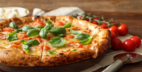 Delicious pizza Margherita on wooden table, closeup
