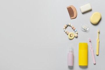 Different bath accessories for baby on light background