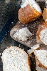sliced loaf of bread on a cutting wooden board