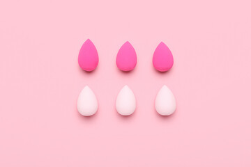 Set different of makeup sponges on pink background