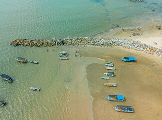 Aerial drone view of many fishing boats by the coast in Tanjung Kempit, Mersing, Johor, Malaysia