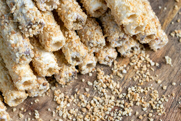 waffle tube with chocolate filling and crushed peanuts