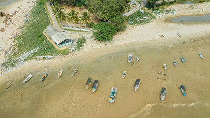Aerial drone view of many fishing boats by the coast in Tanjung Kempit, Mersing, Johor, Malaysia