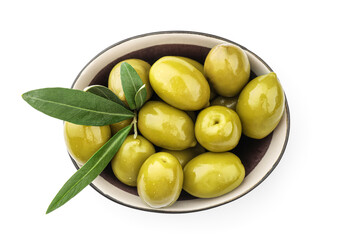Bowl of delicious green olives on white background