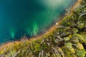 Aerial top down view of beautiful green waters of lake Gela. Clouds reflecting in Gela lake, near Vilnius city, Lithuania