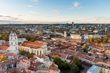 Fototapeta na wymiar Beautiful Vilnius city panorama in autumn with orange and yellow foliage. Fall city scenery in Vilnius, Lithuania