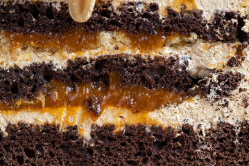 caramel cake with peanuts and buttercream, close up