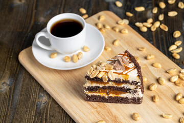 caramel cake with peanuts and buttercream, close up