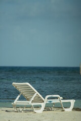 A white chair by the sea on a Colombian beach