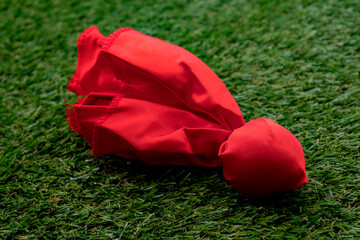 Red challenge flag thrown on the field concept for coach challenging the previous play and American...