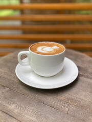 cup of coffee on wooden table