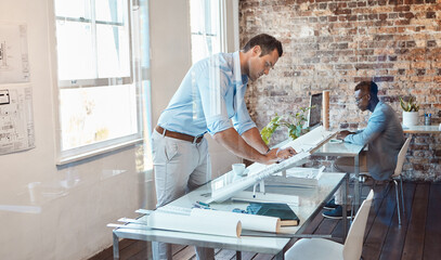 Working, writing and thinking building designer planning infrastructure on blueprint paper in an office. Serious, confident and ambitious architect designing residential, office and city development