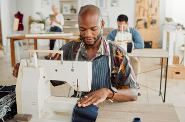 Fashion designer, young man and creative student in a workshop to sew clothes and garments. Factory worker, tailor and apprentice learning sewing machine skills in a textile and manufacturing studio