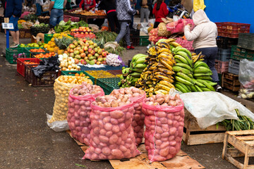 Sales of fruits and vegetables in a traditional Colombian market square