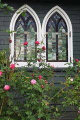 Fototapeta na wymiar Stain glass windows and roses