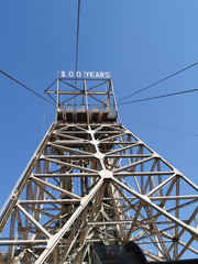 Tall steel pylon against blue sky