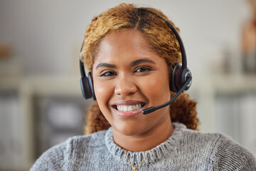 African female call center agent smiling and happy to help in her office at work. Portrait of a...