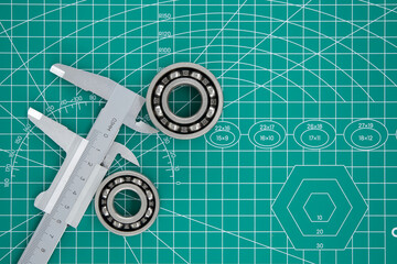 Group of roller bearings and caliper on cutting mat