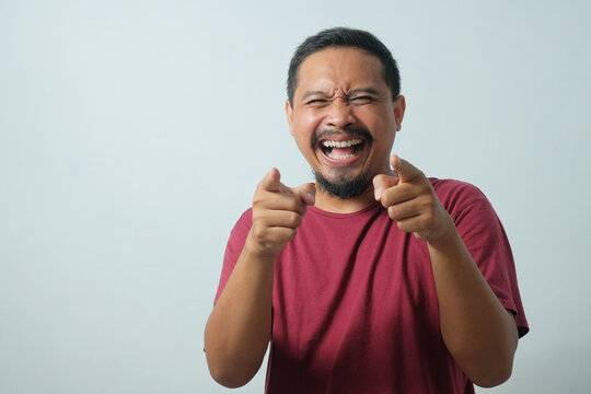man laughing at you while looking at camera