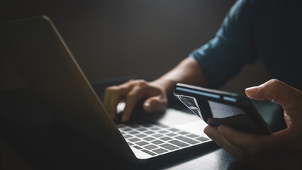 Man using smart phone, Connect mobile data to computer.