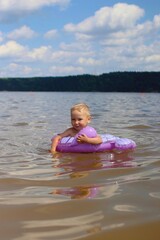 Child hugging his rubber ring