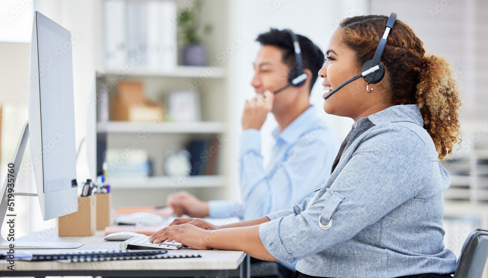 Poster Happy, confident and smiling call centre agent talking on a headset while working on computer in an office. Saleswoman or consultant operating a help desk for customer care and service support