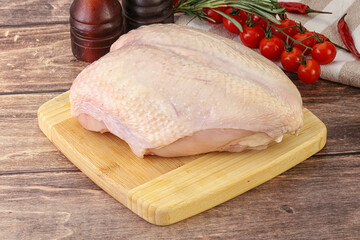 Raw chicken breast with bone