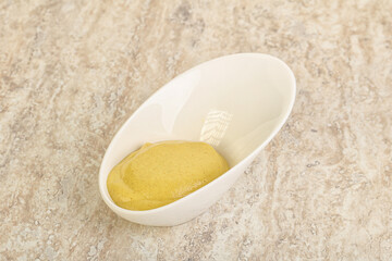 Organic mustard sauce in the bowl