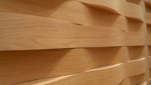 Pan along the absorbing sound treatment patterns on the walls of the Seine Musicale in Paris, France