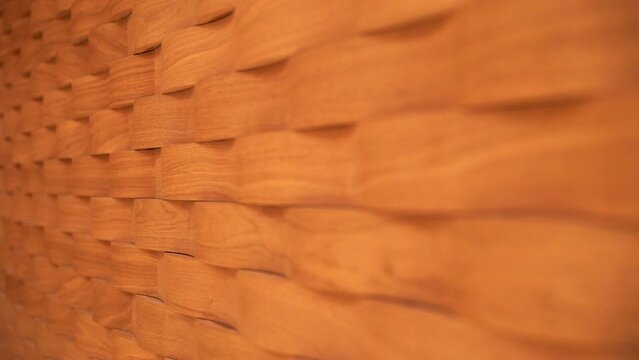 Rack focus along an interesting wooden structure used for sound treatment in the Seine Musicale in Paris, France