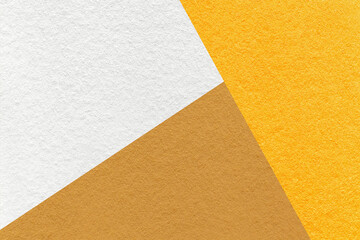 Texture of craft white, yellow and light brown shade color paper background. Structure of abstract cardboard