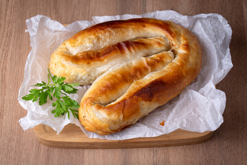 Turkish Kol Borek with minced meat serving