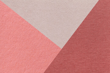 Fototapeta premium Texture of craft red, pink and beige shade color paper background, macro. Structure of vintage abstract rose cardboard