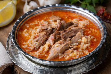 Turkish Soup Beyran with Lamb Meat, Rice, Chopped Garlic and Vinegar Sauce. Traditional Organic Food. Traditional soup of Gaziantep, Turkey. (Turkish name; Beyran corbasi)