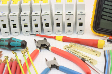 Electrical tools and materials for the installation of an electrical panel. 