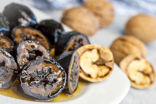 Handmade jam made from green fresh walnuts. Organic walnut jam and walnuts. Walnut dessert. Turkish name; Ceviz receli - ceviz tatlisi