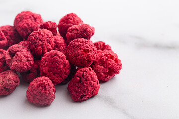 A Pile of Freeze Dried Raspberries on a Marble Counter