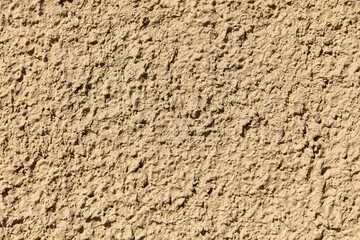 Decorative plaster on the wall of the house as an abstract background.