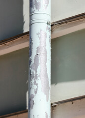 Old drain pipe against the wall