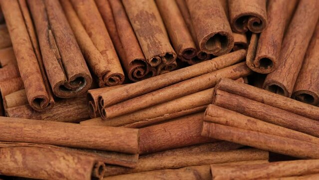Cinnamon. Cinnamon stick close up, rotation. Heap of cinnamon stick